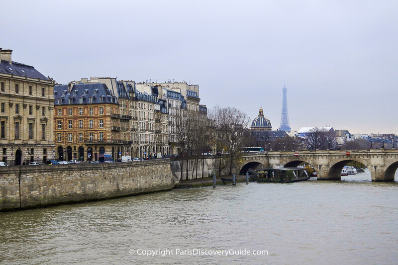 Skyline view of Paris's Right Bank, the Pont Neuf bridge, Institut de France, and the Eiffel Tower