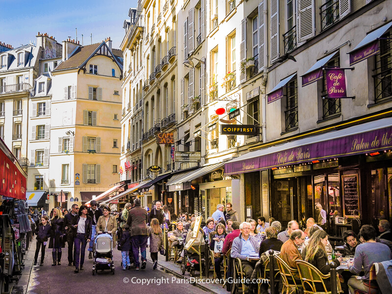Outdoor tables Rue Buci in Paris's 6th arrondissement in early April Outdoor tables Rue Buci in Paris's 6th arrondissement in early April