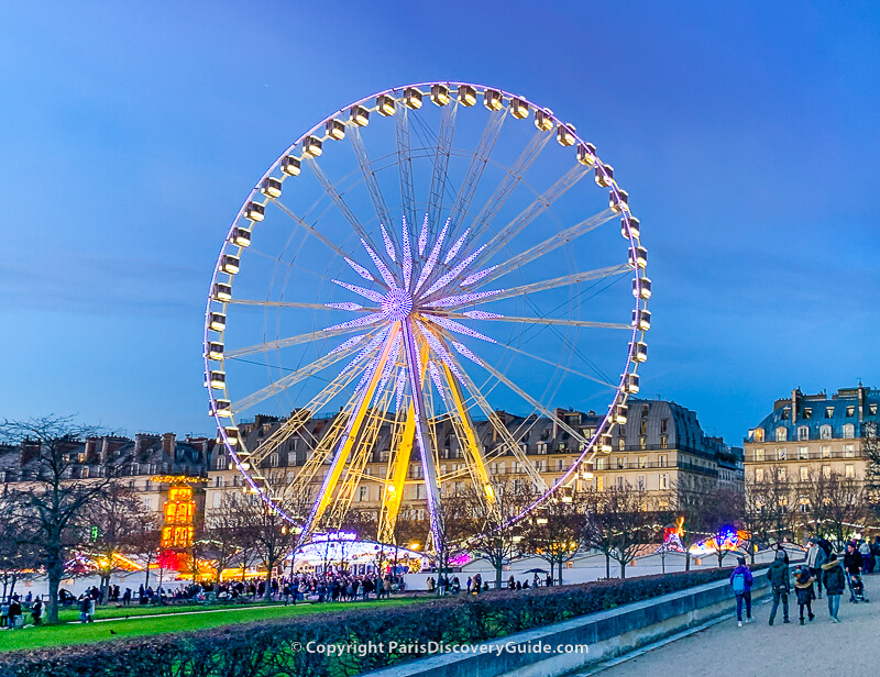 Giant ferris wheel at Tuileries Christmas Market across from Paris's 1st arrondissement Giant ferris wheel at Tuileries Christmas Market across from Paris's 1st arrondissement
