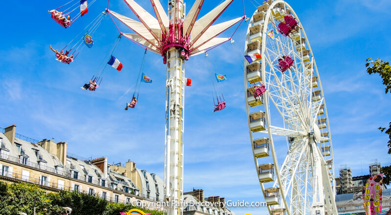 Giant ferris wheel and thrill ride at Tuileries Garden Carnival