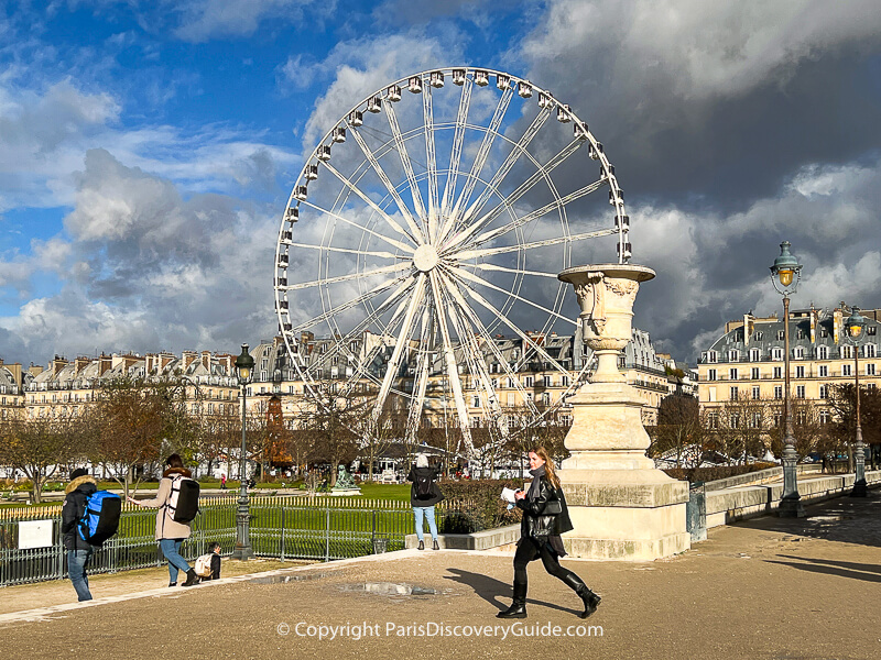 Blue sky and dark clouds over Tuileries Garden in Paris in late November