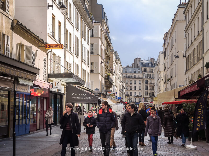 Rue Cler in the 7th arrondissement on a cloudy March day