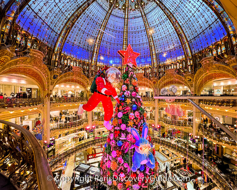 A giant candy tree floats from Galeries Lafayette's domed ceiling A giant candy tree floats from Galeries Lafayette's domed ceiling