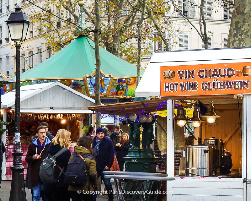 Vin chaud at the Abbesses Christmas Market in Montmartre Vin chaud at the Abbesses Christmas Market in Montmartre