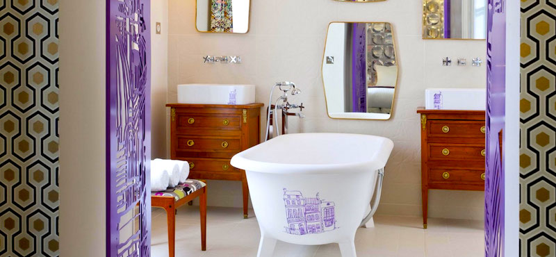 Vibrant graphic design meets antique furnishings in this Hôtel Crayon bathroom in Paris's 1st Arrondissement Vibrant graphic design meets antique furnishings in this Hôtel Crayon bathroom in Paris's 1st Arrondissement