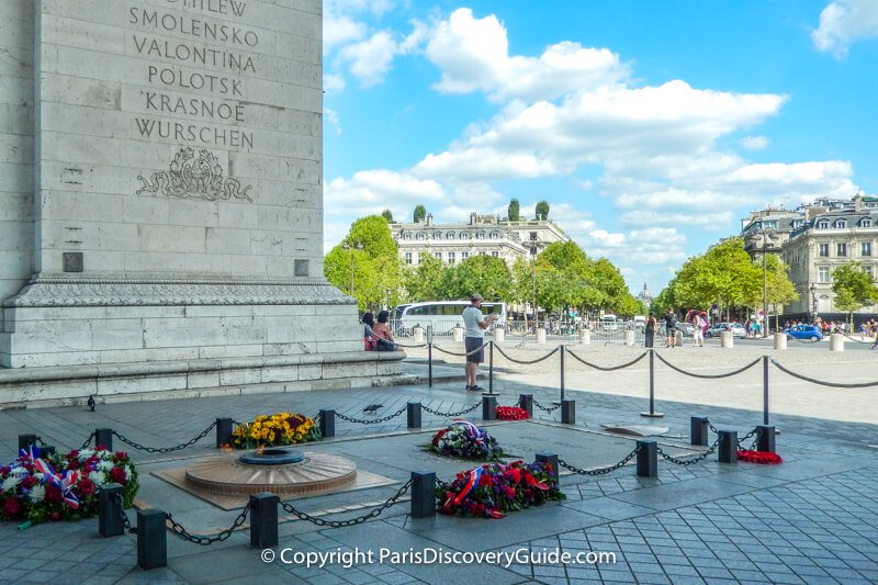 Eternal flame at the Tomb of the Unknown Soldier under the Arc de Triomphe in Paris