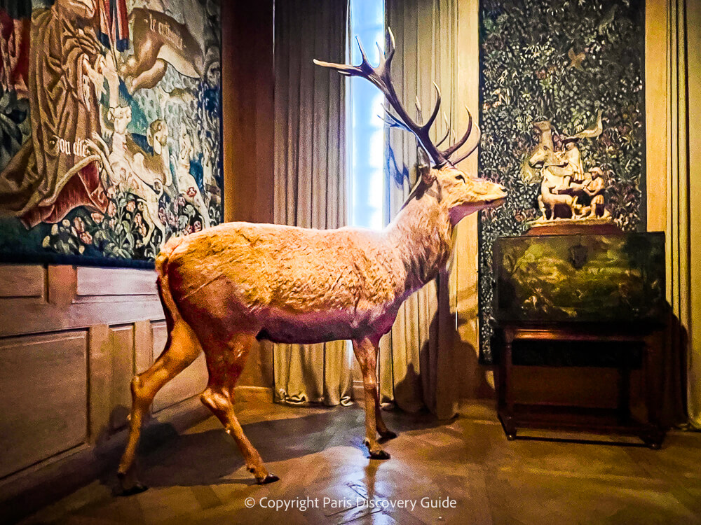 Elk, tapestries, tea chest, and sculpture in Musée de la Chasse et de la Nature