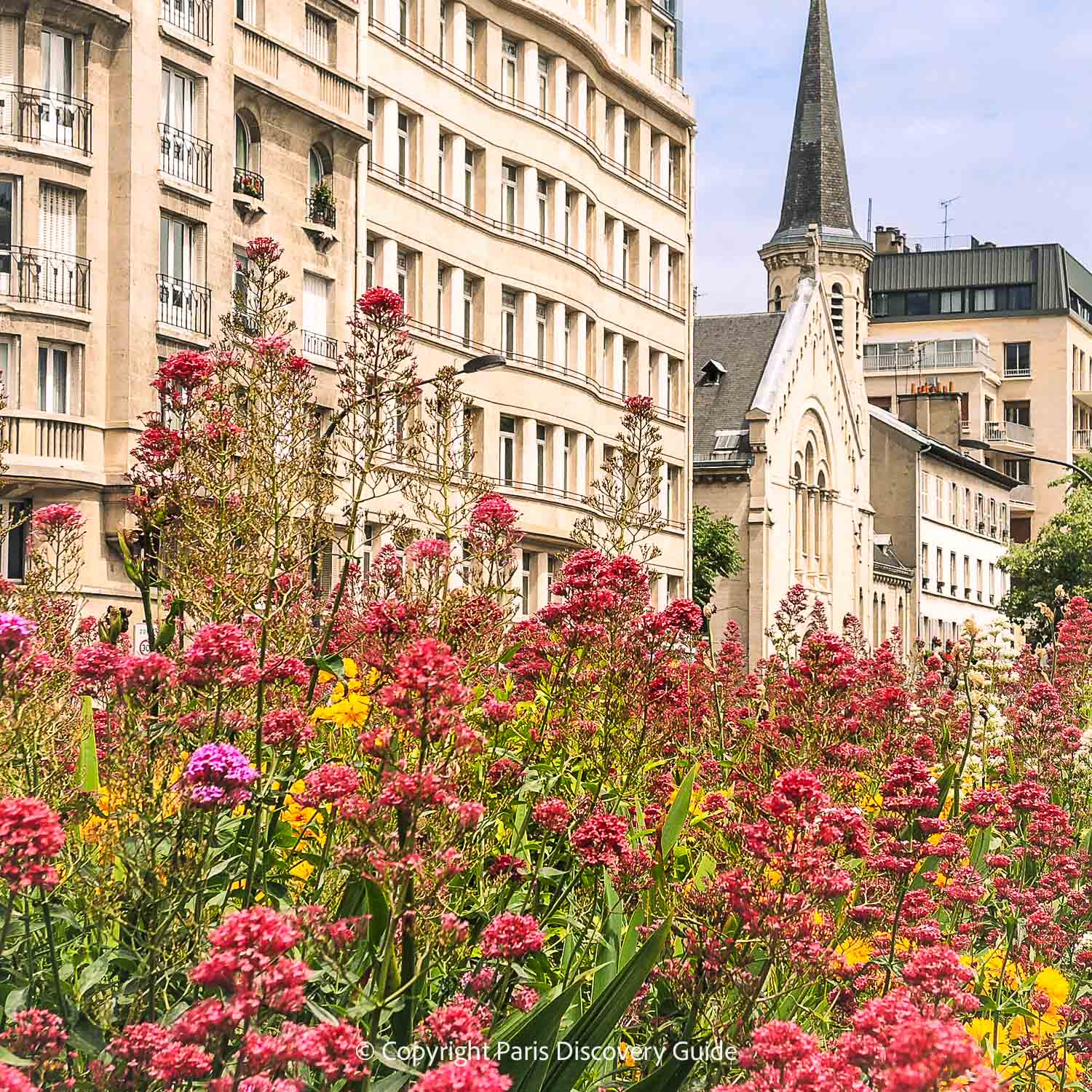 Flowers blooming in a public square in the Batignolles neighborhood in Paris's 17th Arrondissement Flowers blooming in a public square in the Batignolles neighborhood in Paris's 17th Arrondissement