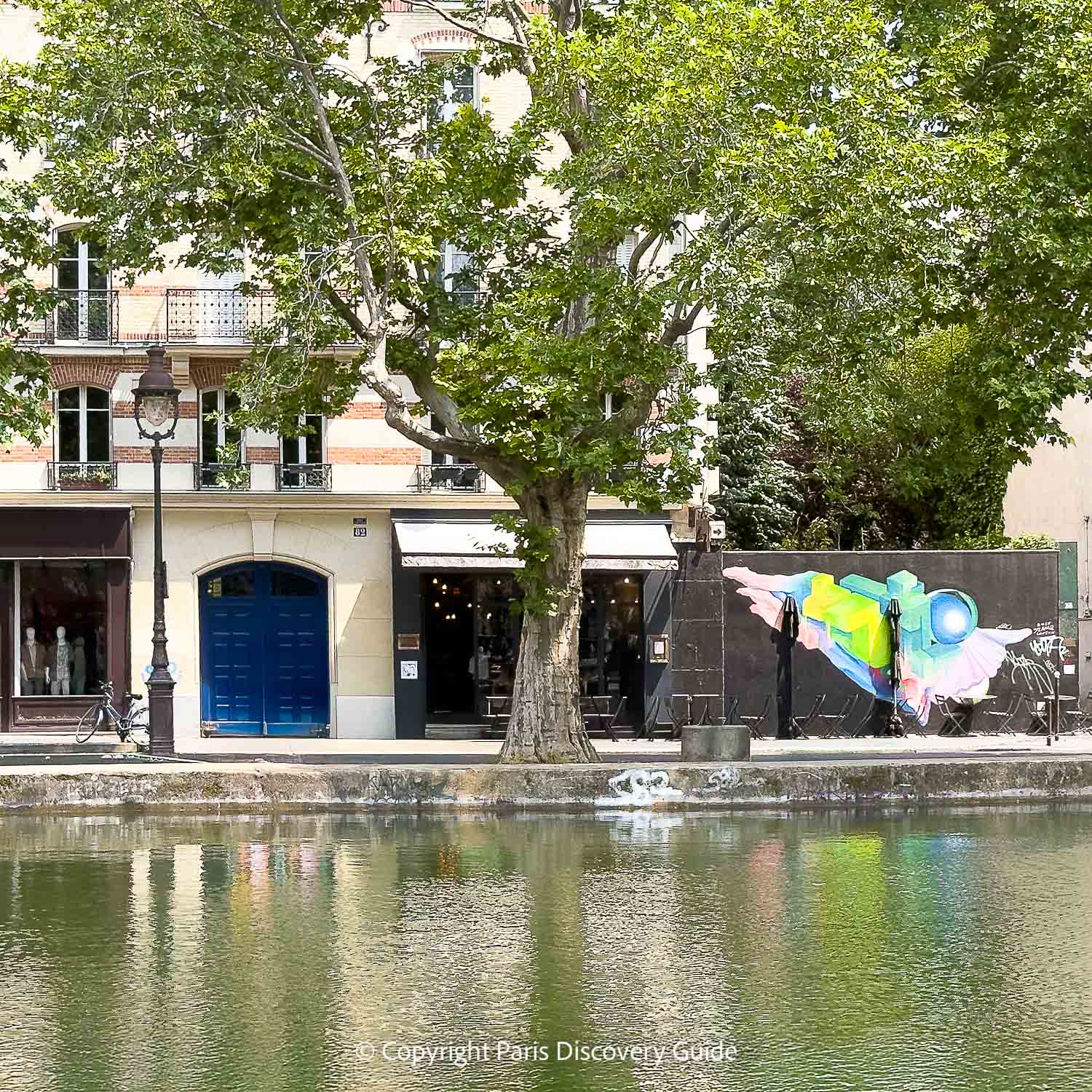 Colorful mural next to Canal Saint-Martin in Paris's 10th arrondissement