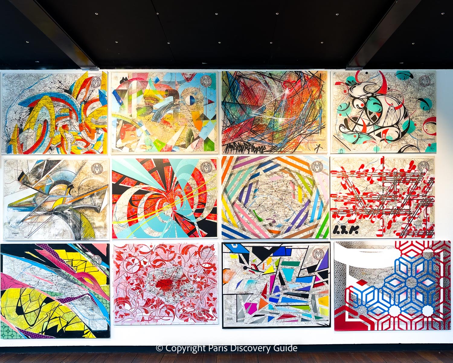 Urban artists' creations based Paris maps in a theme-based exhibition at Fluctuart