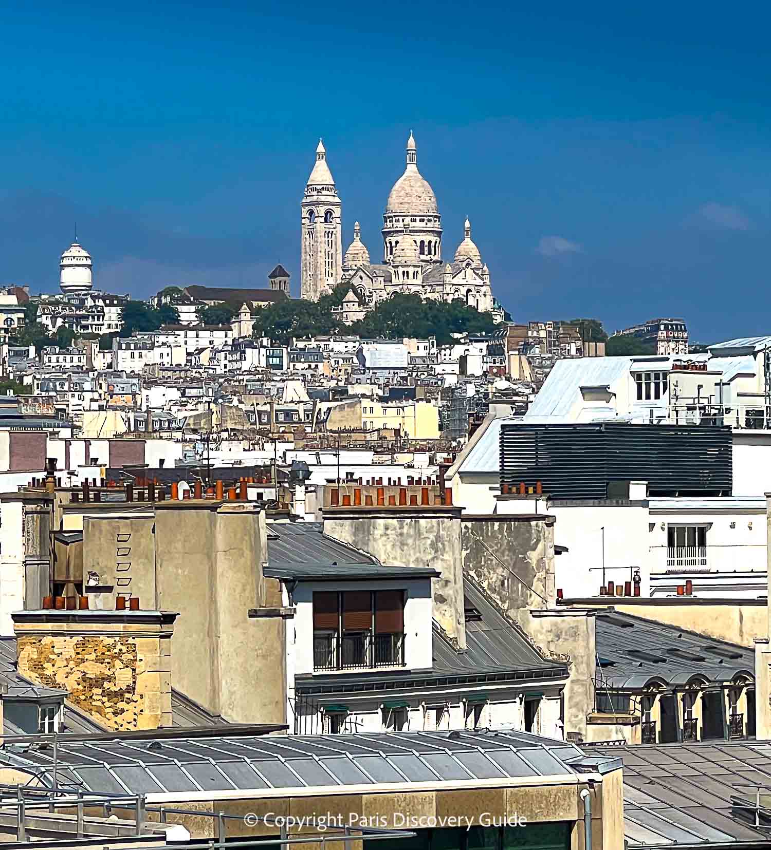 View of Sacre Coeur from the rooftop terrace at Galeries Lafayette - Photo credit: istockphotos.com/Maria Gribova View of Sacre Coeur from the rooftop terrace at Galeries Lafayette - Photo credit: istockphotos.com/Maria Gribova