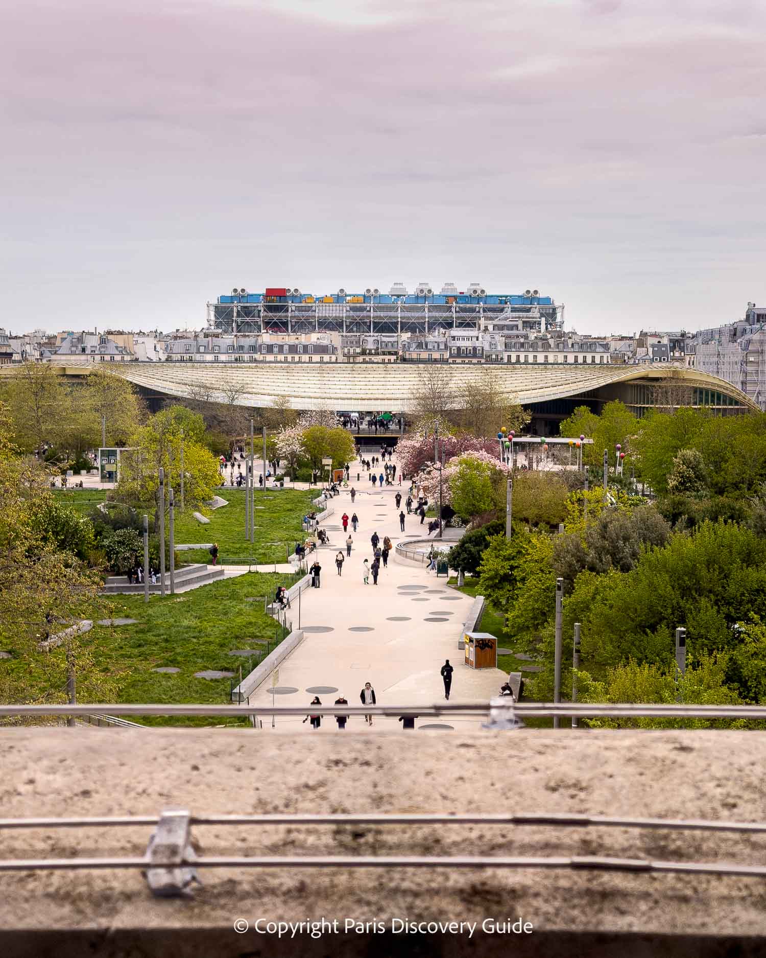 View from Halle aux Grains: The rooftop of Forum des Halles, tops of neighborhood buildings, and in the distance, the 'inside out' architecture of Centre Pompidou