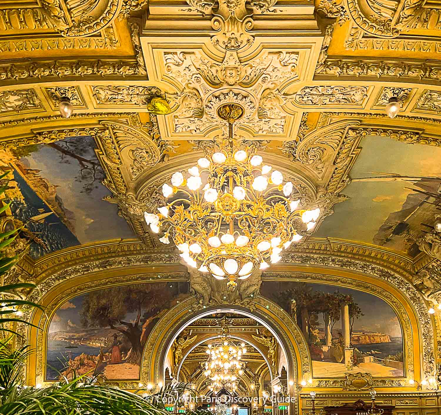 The ornate Art Nouveau ceiling at Le Train Bleu