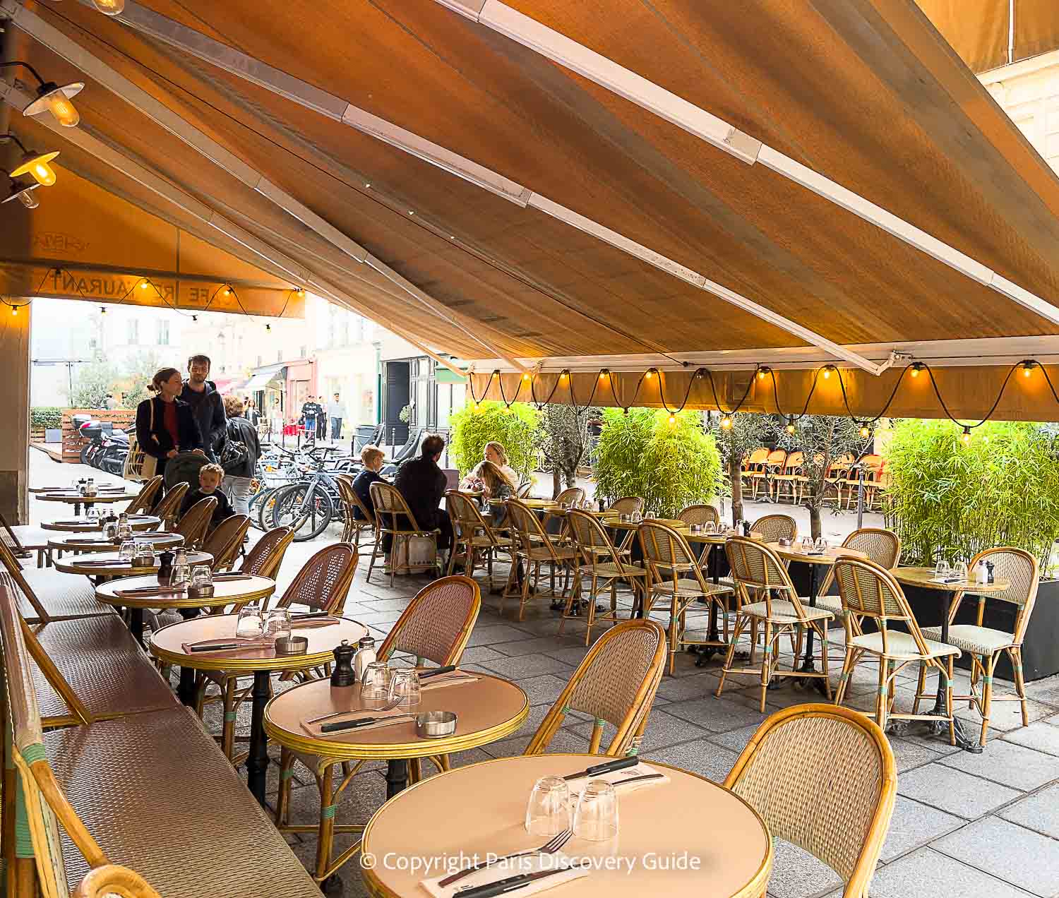 Quiet plaza with several cafes near Le Grand Mazarin