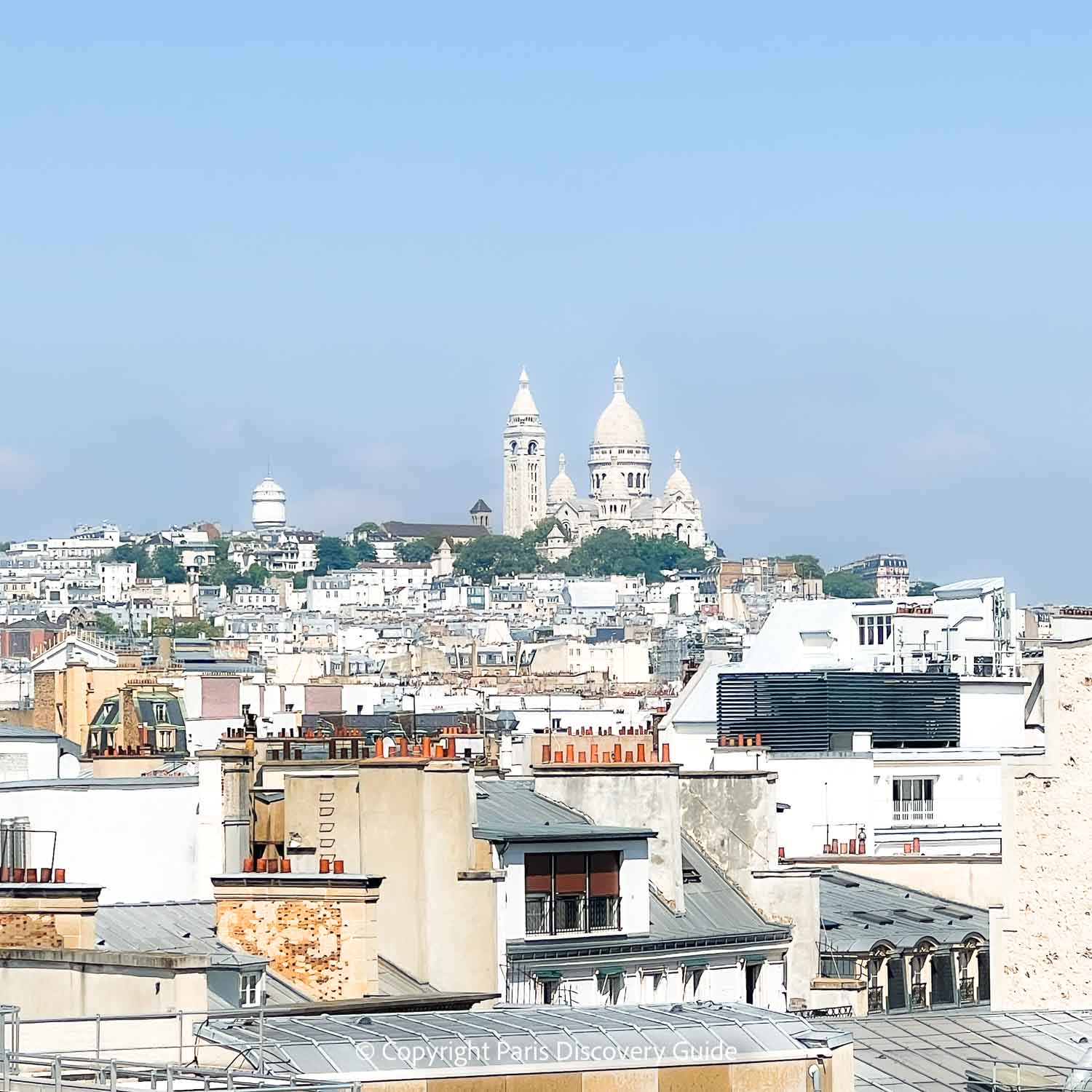 View of Sacré Coeur Basilica in Montmartre from Printemps rooftop terrace