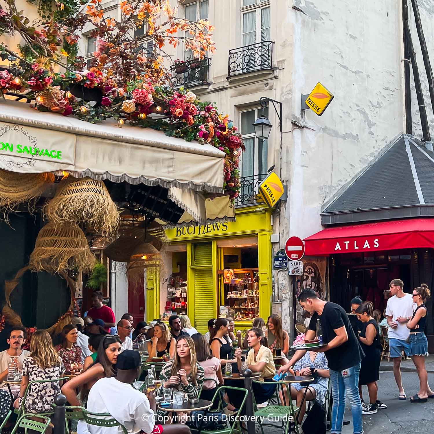 Diners along Rue Buci in Saint-Germain in the summer