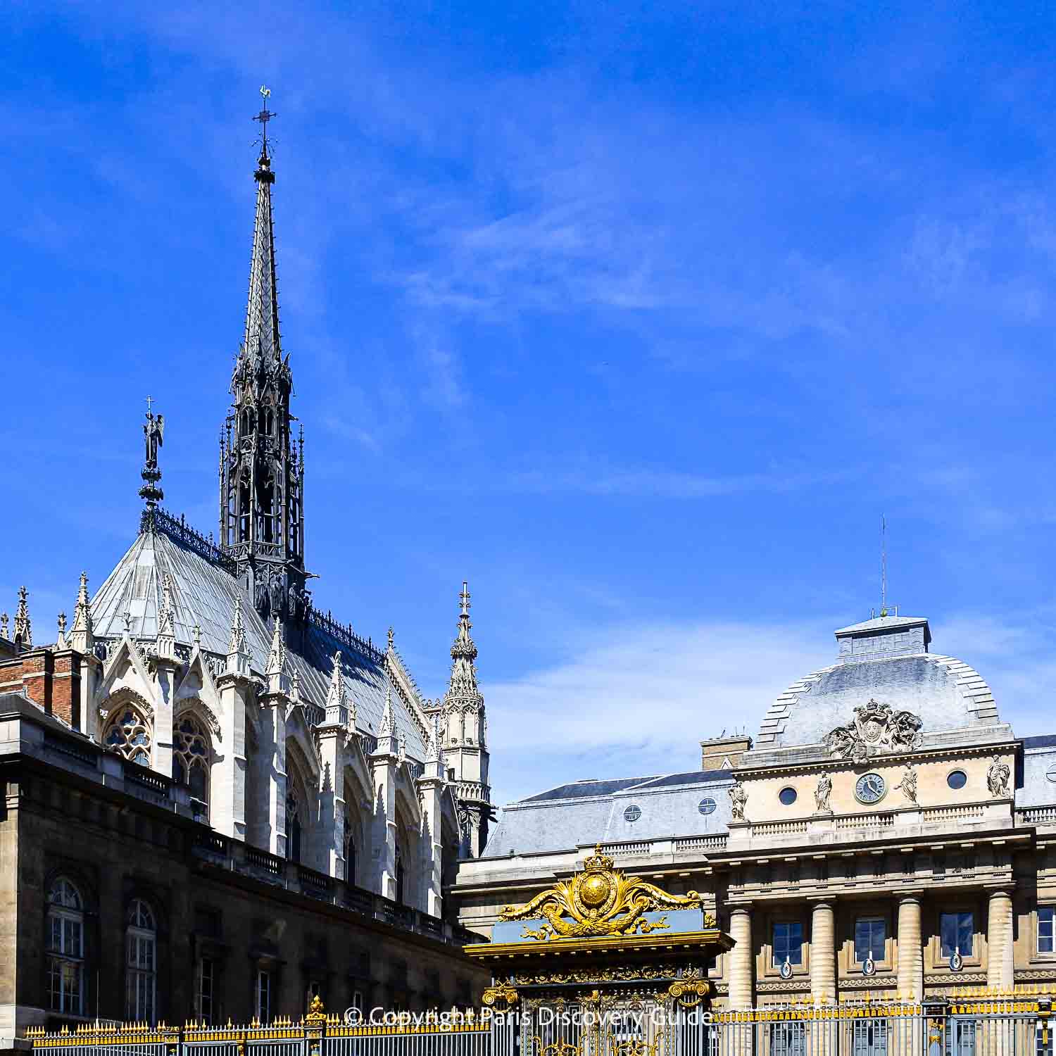 Steeple and spires of Sainte Chapelle behind the Palais de Justice Steeple and spires of Sainte Chapelle behind the Palais de Justice
