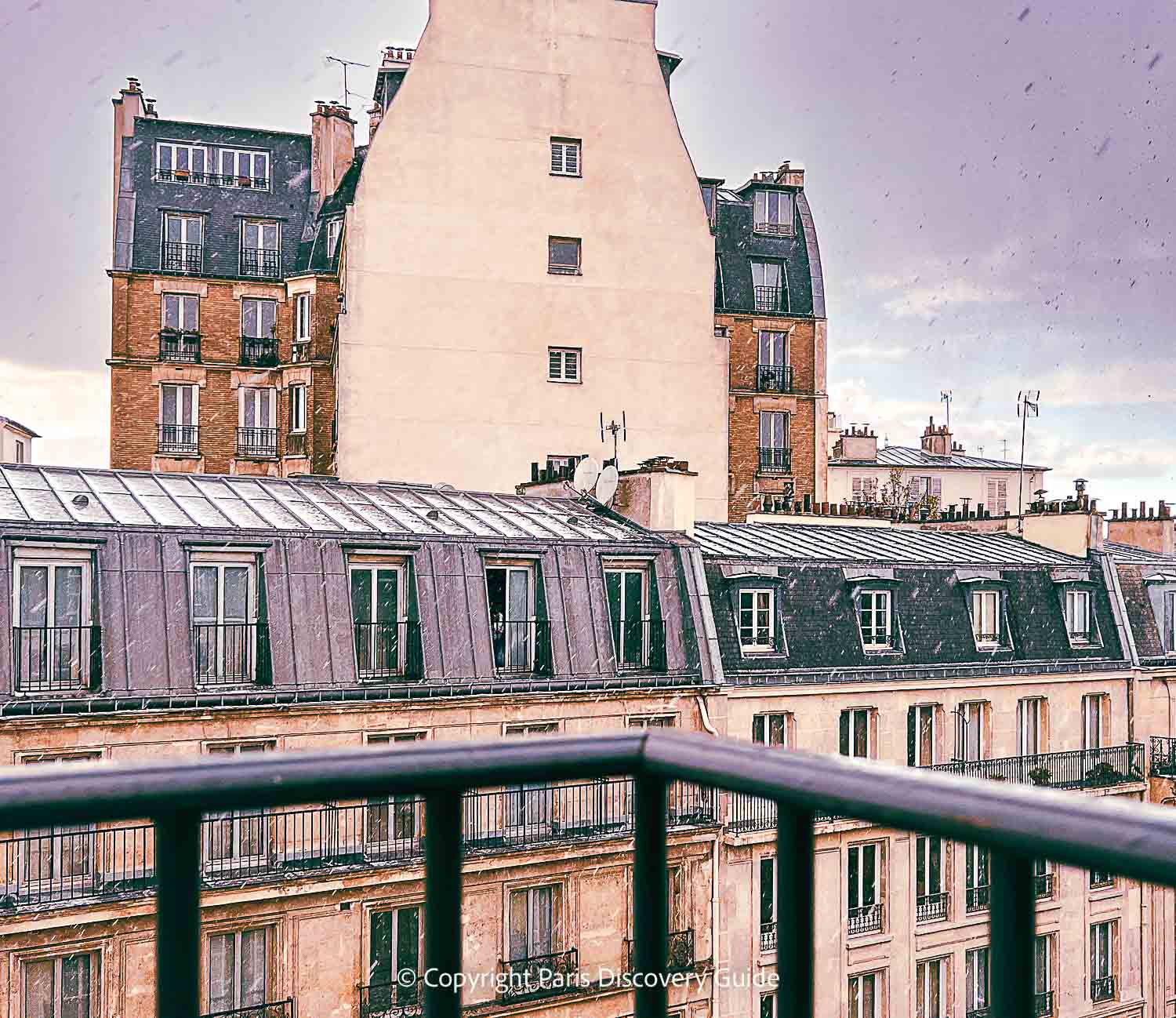 Place des Vosges in the Marais on a mostly sunny day in early April Place des Vosges in the Marais on a mostly sunny day in early April