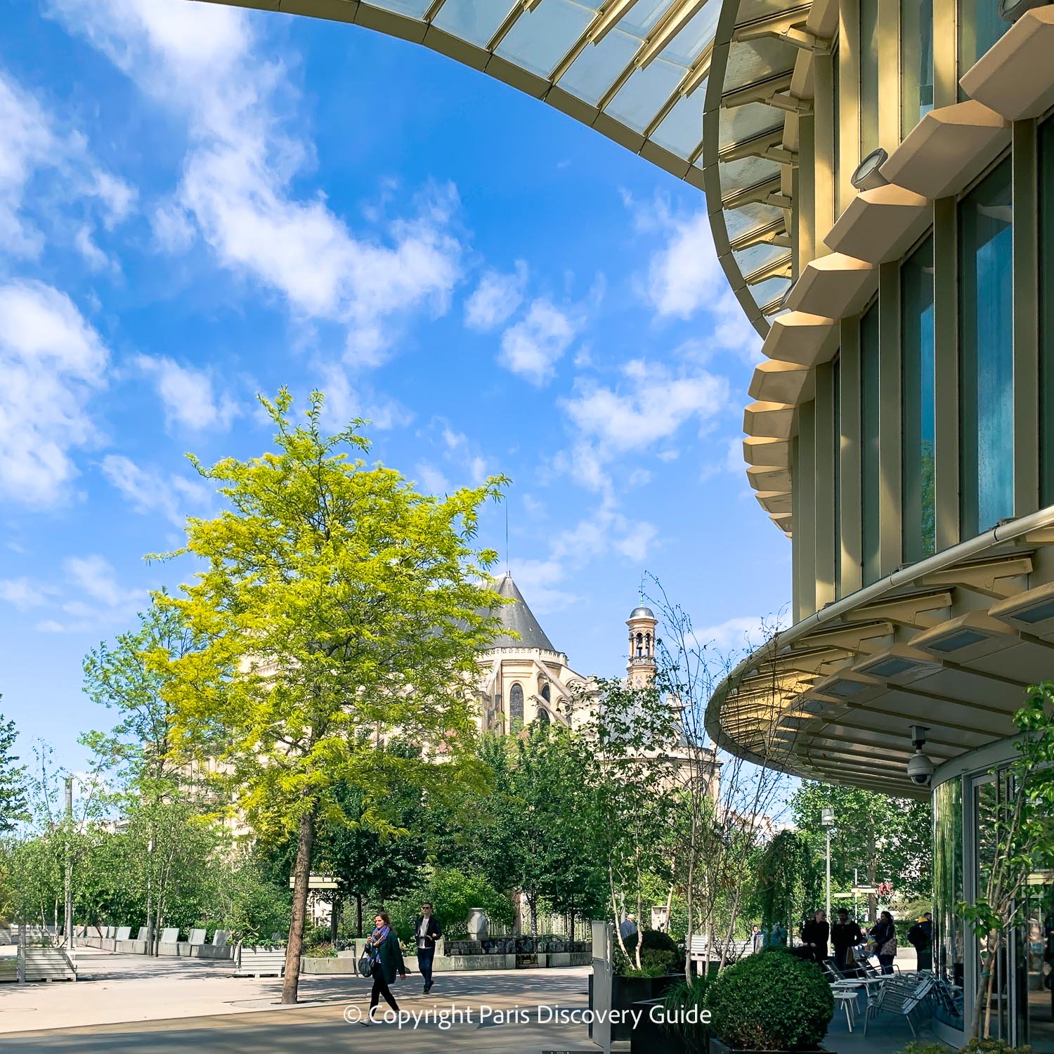 Les Halles neighborhood, with Saint Eustache Church and cafe seating at Forum des Halles on the right