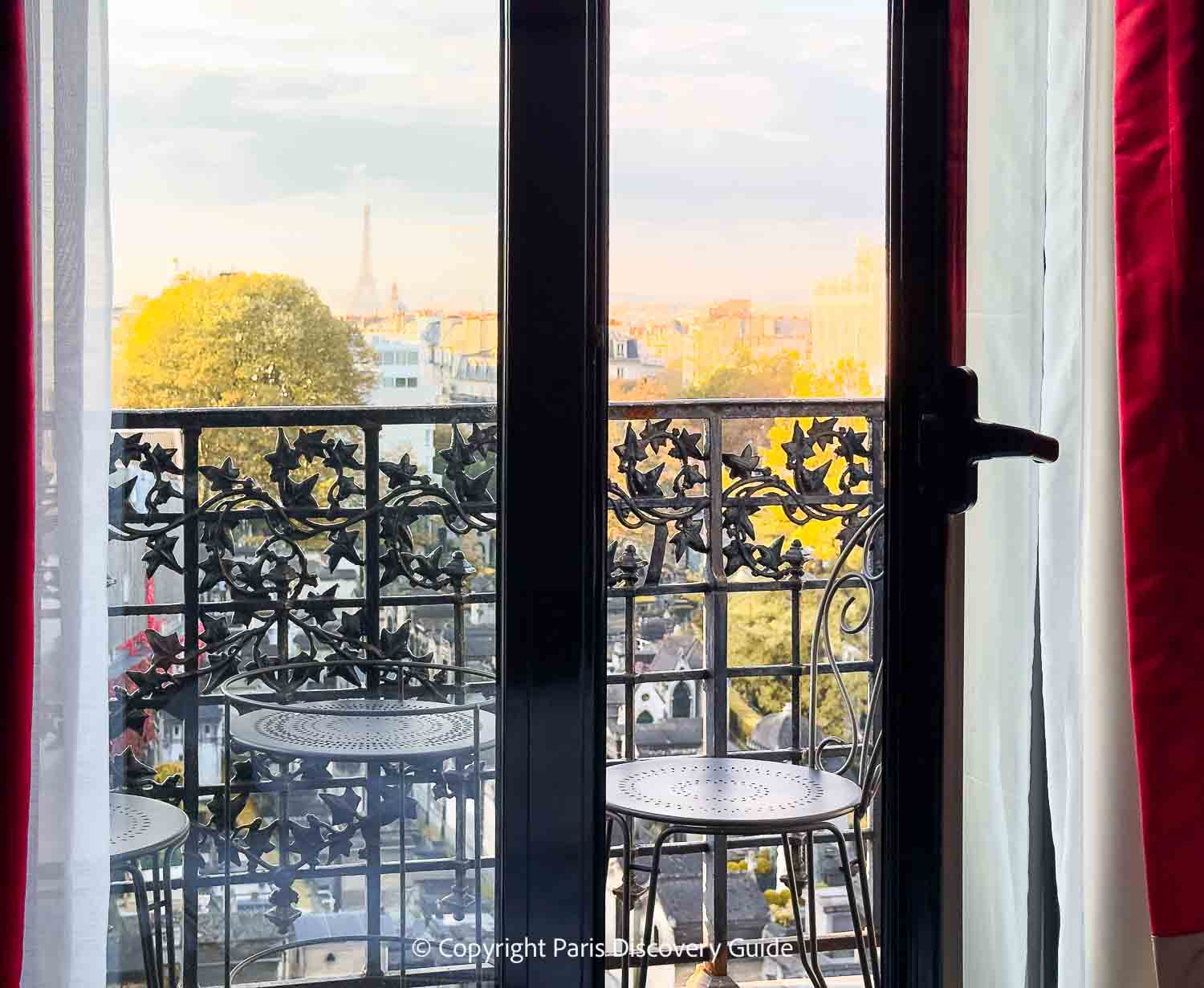 View of fall foliage and the Eiffel Tower from my balcony during a stay at Hotel Terrass in Montmartre View of fall foliage and the Eiffel Tower from my balcony during a stay at Hotel Terrass in Montmartre