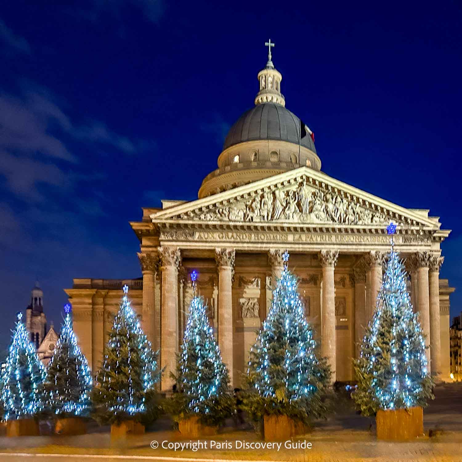 Lighted Christmas trees surrounding the Pantheon in Paris's Latin Quarter