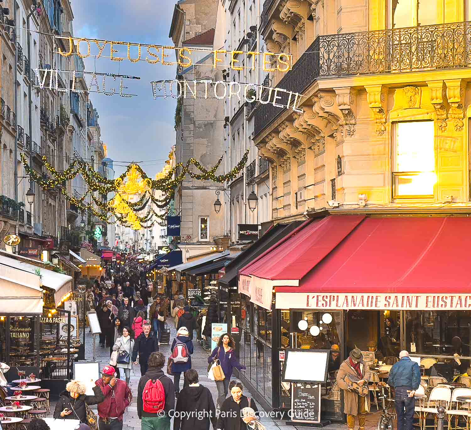 Christmas garlands decorating Rue Montorgueil near the Les Halles metro station and the Christmas market
