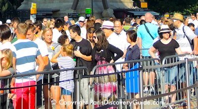 Crowd waiting in line at Eiffel Tower in Paris