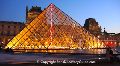 Louvre pyramid at night in Paris 