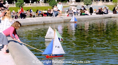 Toy sail boats on pond in Luxembourg Garden, Paris