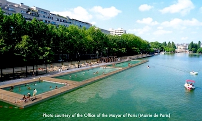 Shoppers from nearby rue de Rivoli walk over to cool off under the mist fountain - another popular feature at the Paris City Hall "beach" Shoppers from nearby rue de Rivoli walk over to cool off under the mist fountain - another popular feature at the Paris City Hall "beach"