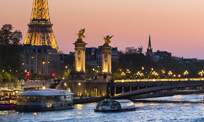 Cruise boat on the Seine River near the Eiffel Tower 