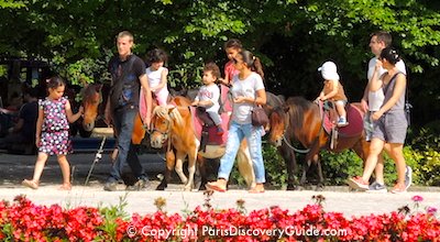 Pony rides for children at Square Georges Brassens in Paris Pony rides for children at Square Georges Brassens in Paris