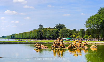 Apollo Fountain and Grand Canal at Versailles, attractions seen during a guided tour of the Palace gardens Apollo Fountain and Grand Canal at Versailles, attractions seen during a guided tour of the Palace gardens