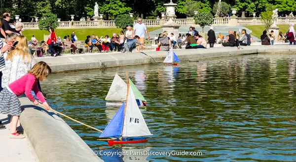 Toy sail boats on pond in Luxembourg Garden, Paris