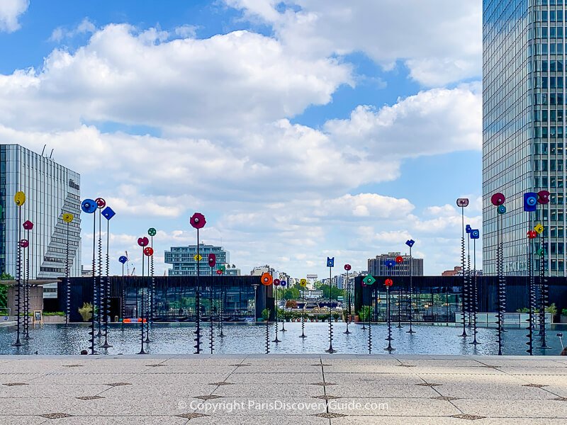 View down the La Defense Esplanade with the Arc de Triomphe in Paris in the distance View down the La Defense Esplanade with the Arc de Triomphe in Paris in the distance