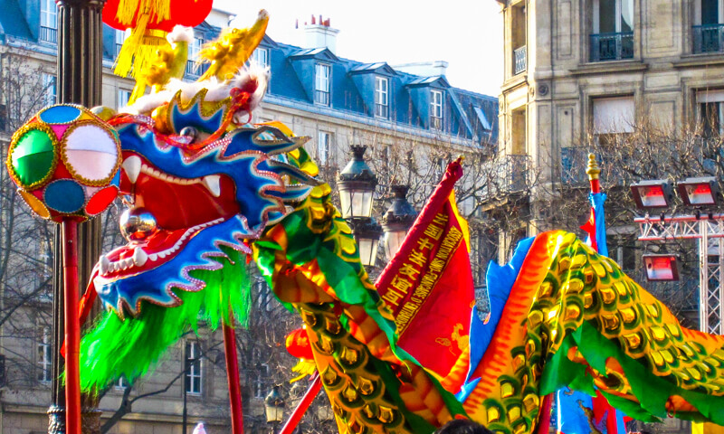 Marchers carrying flags in Paris Chinese New Year Parade Marchers carrying flags in Paris Chinese New Year Parade