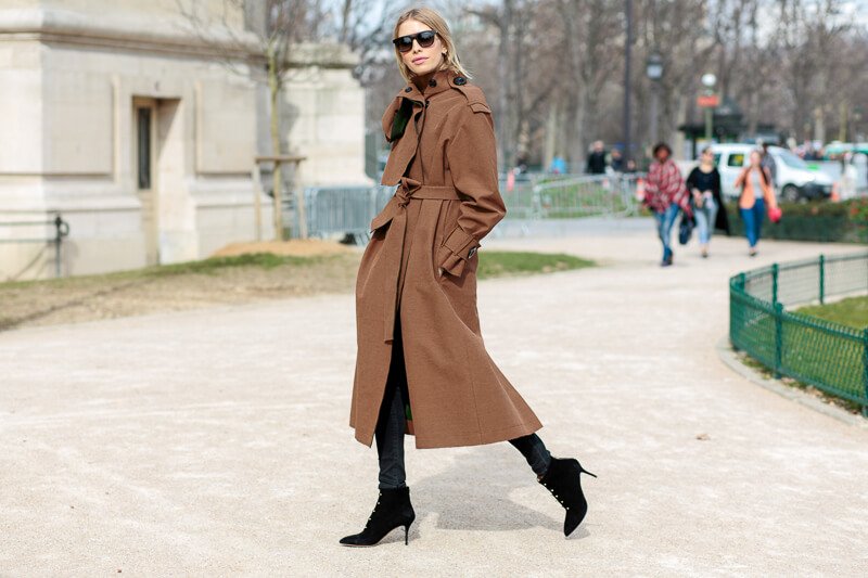 Model before the Thierry Mugler show wearing an A.W.A.K.E coat, Dior sunglasses and Charlotte Olypmia boots at Paris Fashion Week - Photo credit: istock.com/cocomtr