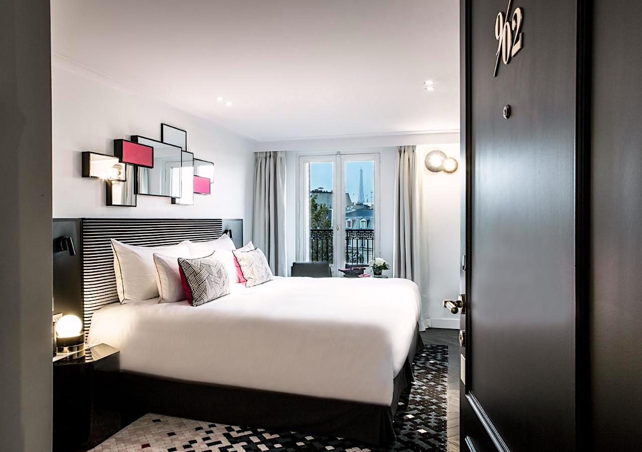 Guestroom with balcony and Eiffel Tower view at Hôtel Fauchon