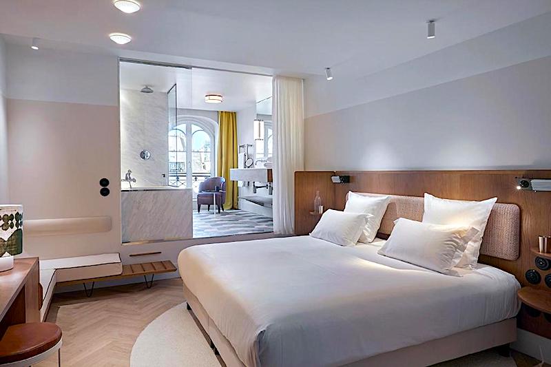 Terrace room and bath at Hotel du Sentier in Paris's 2nd district