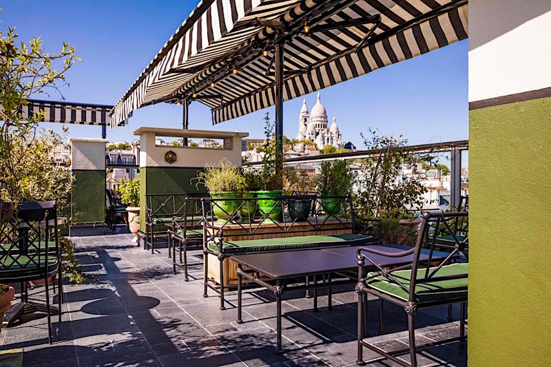 View of Sacre Coeur from the rooftop terrace and bar at Hotel Rochechouart View of Sacre Coeur from the rooftop terrace and bar at Hotel Rochechouart