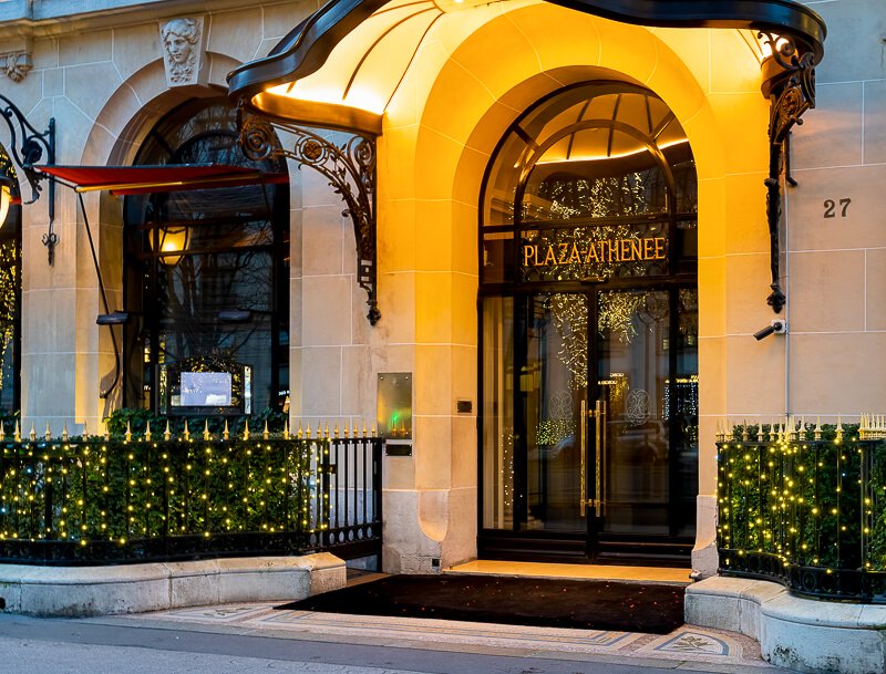 Le Plaza Athénée entrance with Christmas lights - Photo credit:  iStock.com/UlyseePixel