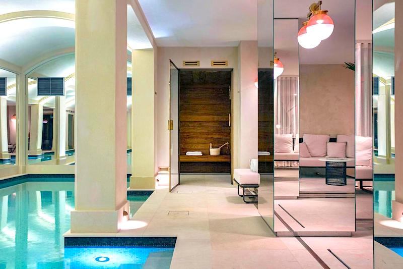 Indoor pool and spa area in Les Jardins du Faubourg Hotel