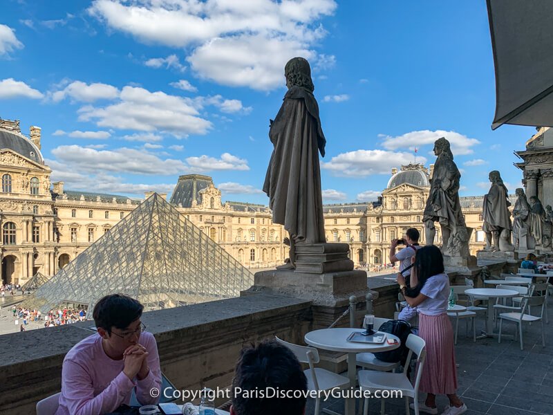 Cafe Molien's terrace seating overlooking the Pyramid at the Louvre Museum