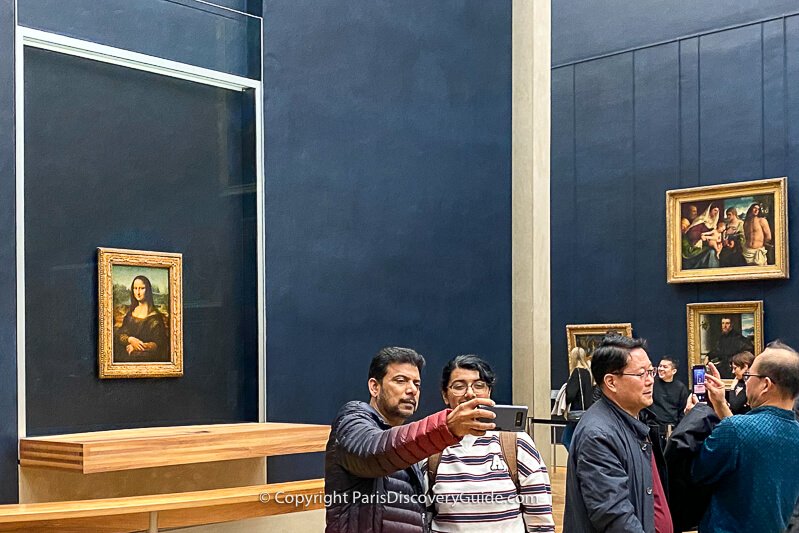 Mona Lisa on display in a bullet-proof glass case in the Louvre 
