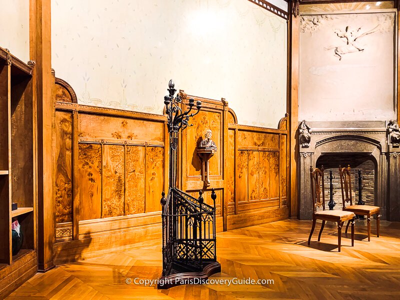 The centerpiece of this room is the wrought iron coat rack crafted by the leader of Art Nouveau in France, Hector Guimard, who also created the curvy Paris Metro signs and entrances you can still see at some stations