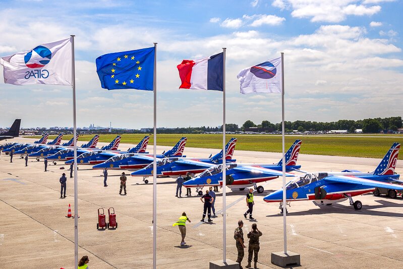  French and EU flags in front of the Patrouille de France aerobatic team at the Paris Air Show - Credit: iStock/VanderWolf-Images