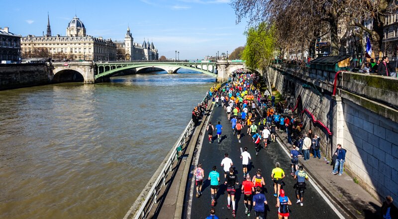 Paris Marathon runners along the Seine River