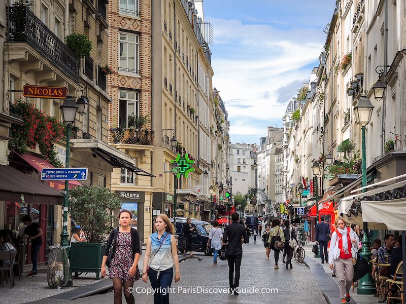 Rue Montorgueil market street on a partly-cloudy August afternoon