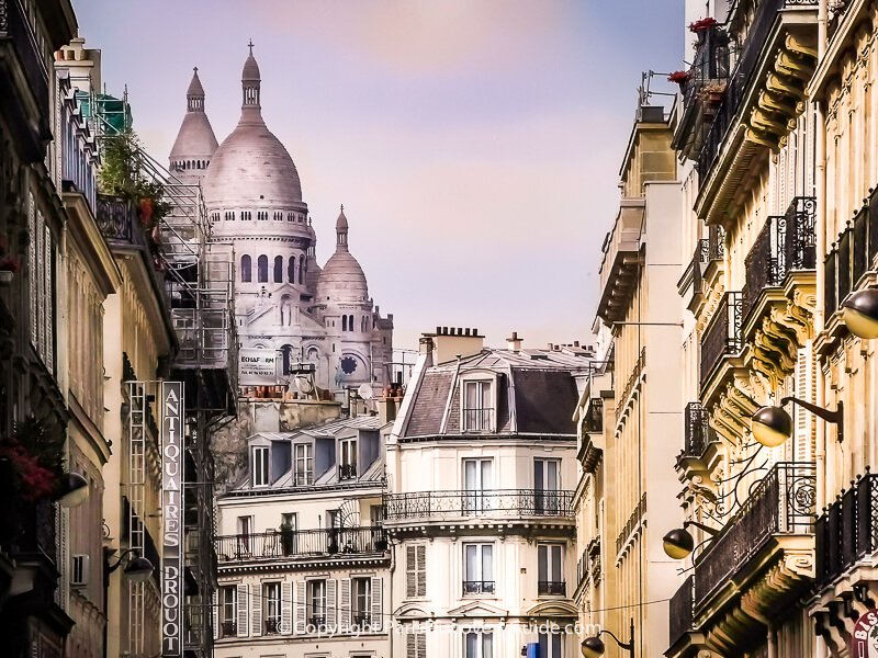 View of Sacre Coeur from Rue Rossini in Paris's 9th District