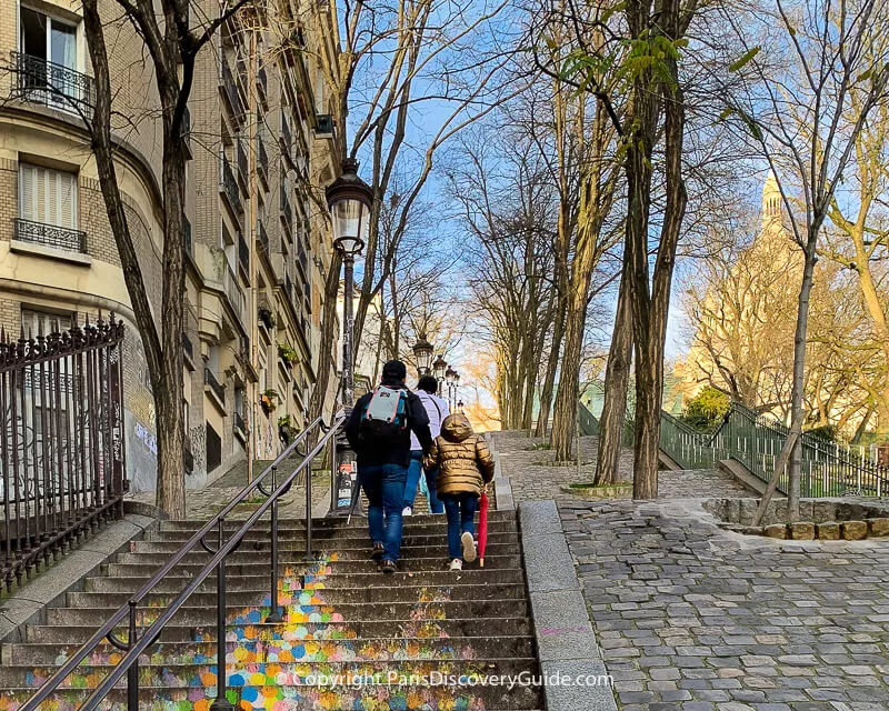 Climbing the steps up to Sacre Coeur in Montmartre